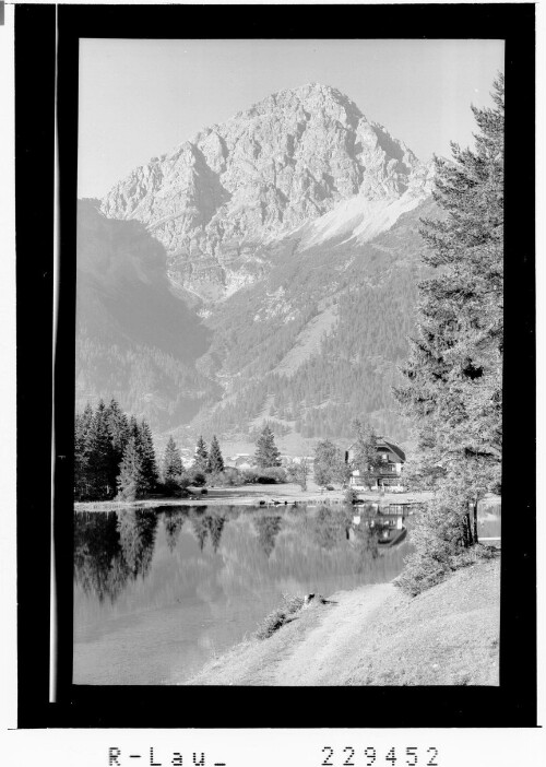 [Heiterwangersee mit Hotel Fischer am See gegen Thaneller / Tirol]