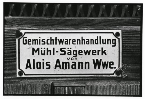 Hohenems, Türschild  Gemischtwarenhandlung Mühl-Sägewerk von Alois Amann Wwe. 